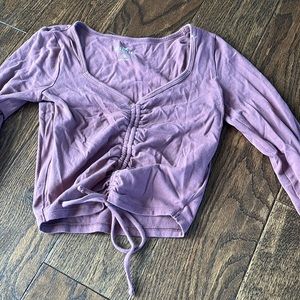 mauve colored long sleeved shirt